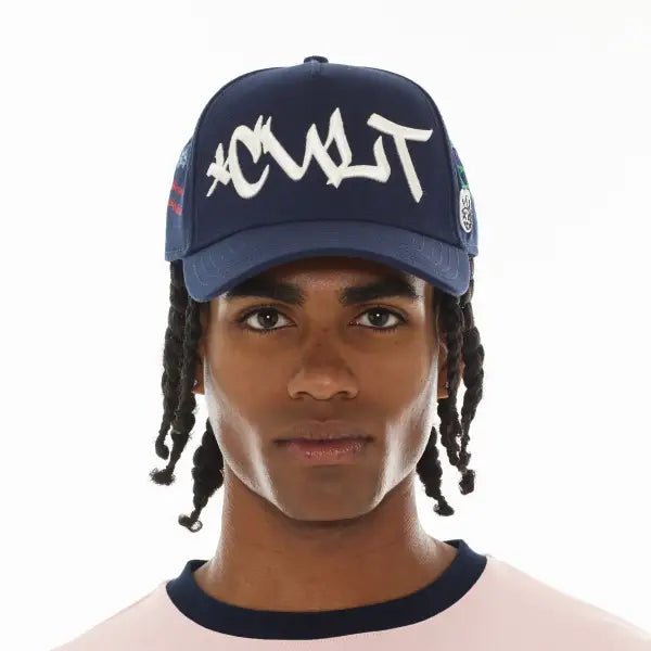 Cult graffiti mesh trucker hat by CULT OF INDIVIDUALITY